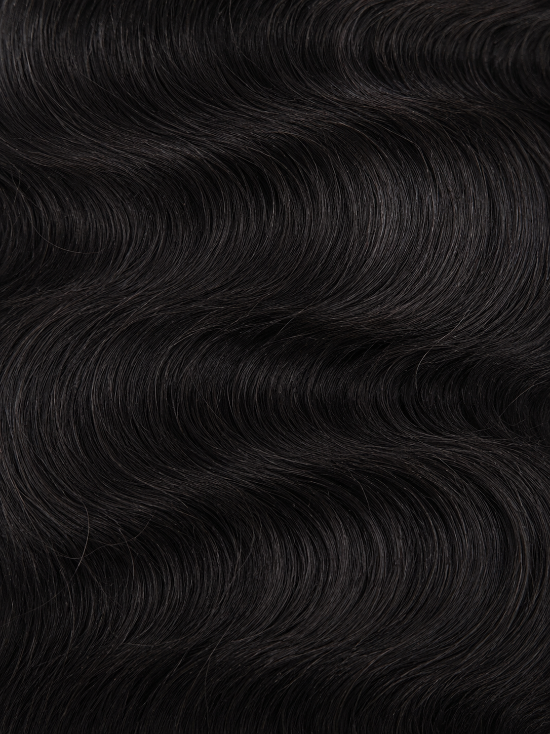 A close-up of glossy black waves